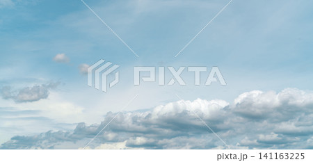 Panorama view of white fluffy clouds on blue sky. Close-up white cumulus clouds texture background. White puffy cloudscape. Beauty in nature. Soft-touch feeling like cotton. Beautiful cloudscape. Panorama view of white fluffy clouds on blue sky. Close-up white cumulus clouds texture background. White puffy cloudscape. Beauty in nature. Soft-touch feeling like cotton. Beautiful cloudscape. 141163225