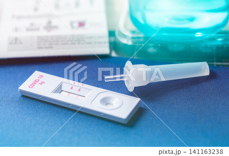 Covid 19 antigen self test for nasal swab with positive result. Antigen test kit for home use to detection coronavirus infection. Positive test result from rapid antigen test. Coronavirus diagnosis. Covid 19 antigen self test for nasal swab with positive result. Antigen test kit for home use to detection coronavirus infection. Positive test result from rapid antigen test. Coronavirus diagnosis. 141163238