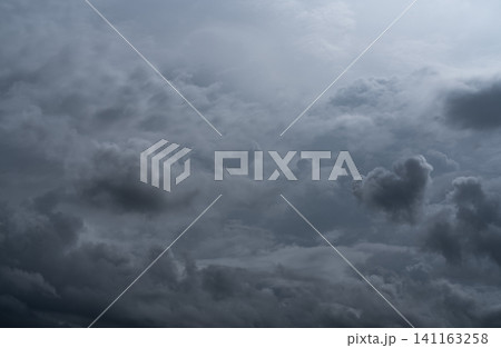 Dark dramatic sky and clouds. Background for death and sad concept. Gray sky and fluffy white clouds. Thunder and storm sky. Sad and moody sky. Nature background. Dead abstract background. Cloudscape. Dark dramatic sky and clouds. Background for death and sad concept. Gray sky and fluffy white clouds. Thunder and storm sky. Sad and moody sky. Nature background. Dead abstract background. Cloudscape. 141163258