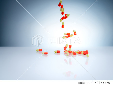 Orange and yellow capsule pills falling onto reflective surface. Pharmaceutical manufacturing, prescription medication, healthcare treatment, drug research, and modern pharmacy. Laboratory research. Orange and yellow capsule pills falling onto reflective surface. Pharmaceutical manufacturing, prescription medication, healthcare treatment, drug research, and modern pharmacy. Laboratory research. 141163270