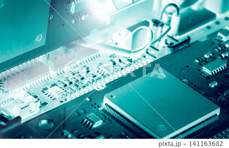 Electronic circuit board. Mainboard of computer. Computer integrated circuit board. Detail of electronic circuit board. Memory of digital information hardware. Electronic engineering technology. Electronic circuit board. Mainboard of computer. Computer integrated circuit board. Detail of electronic circuit board. Memory of digital information hardware. Electronic engineering technology. 141163682