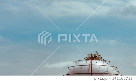Industrial gas storage tank. LNG or liquefied natural gas storage tank. Spherical gas tank in petroleum refinery. Above-ground storage tank. Natural gas storage industry and global market consumption Industrial gas storage tank. LNG or liquefied natural gas storage tank. Spherical gas tank in petroleum refinery. Above-ground storage tank. Natural gas storage industry and global market consumption 141163718