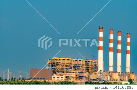 Power Plant. Thermal Power Plant and Combined Cycle Power Plant in Thailand. Power plant using natural gas and petroleum. Air pollution concept. High voltage electric tower station Power Plant. Thermal Power Plant and Combined Cycle Power Plant in Thailand. Power plant using natural gas and petroleum. Air pollution concept. High voltage electric tower station 141163883