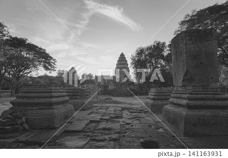 Black and white landscape of Phimai Historical Park. Landmark of Nakhon Ratchasima, Thailand. Travel destinations. Historic site is ancient. Ancient building. Khmer temple classical architecture. Black and white landscape of Phimai Historical Park. Landmark of Nakhon Ratchasima, Thailand. Travel destinations. Historic site is ancient. Ancient building. Khmer temple classical architecture. 141163931