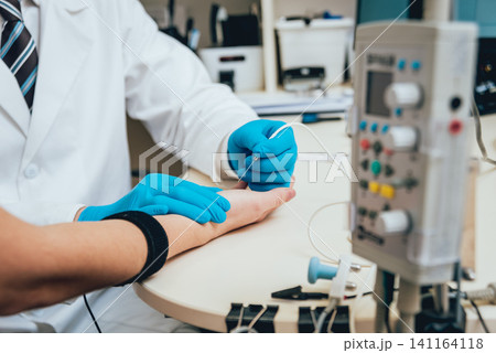 Patient nerves testing using electromyography. EMG Patient nerves testing using electromyography. EMG 141164118