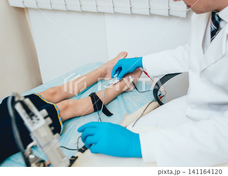 Patient nerves testing using electromyography. EMG Patient nerves testing using electromyography. EMG 141164120