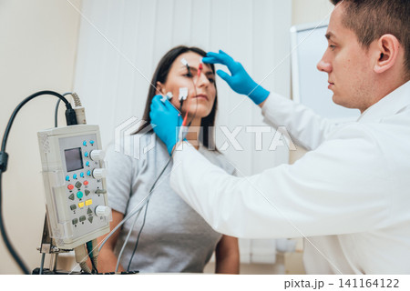 Patient nerves testing using electromyography. EMG Patient nerves testing using electromyography. EMG 141164122