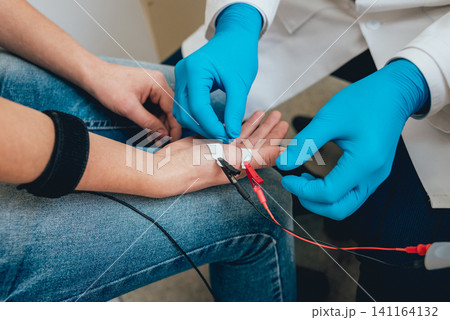 Patient nerves testing using electromyography. EMG Patient nerves testing using electromyography. EMG 141164132