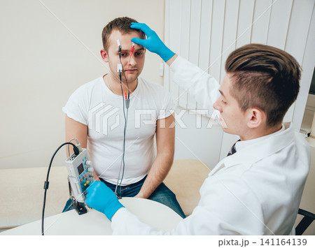 Patient nerves testing using electromyography. EMG 141164139