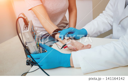 Patient nerves testing using electromyography. EMG Patient nerves testing using electromyography. EMG 141164142
