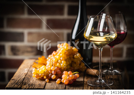 White wine in a glass White wine in a glass 141164235