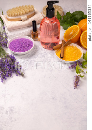 Spa wellness items with lavender and orange bath salts 141165384