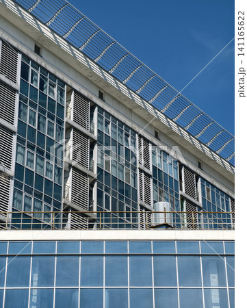 Modern apartment tower with residential balconies and contemporary architecture in city district 141165622