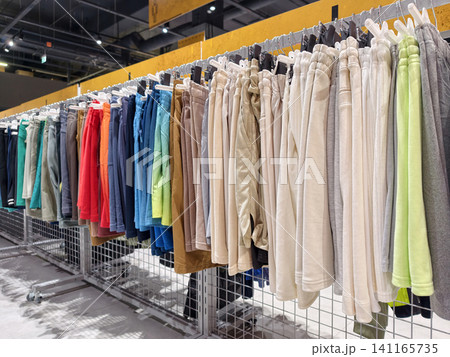 Various colorful athletic shorts arranged in a sporting goods store present a diverse selection of breathable garments for sport and casual use Various colorful athletic shorts arranged in a sporting goods store present a diverse selection of breathable garments for sport and casual use 141165735