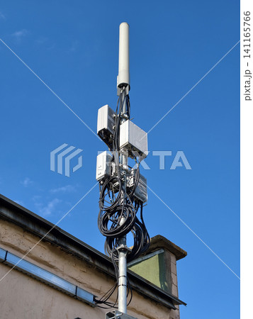 5G tower with antennas and extensive cabling used for network coverage 5G tower with antennas and extensive cabling used for network coverage 141165766