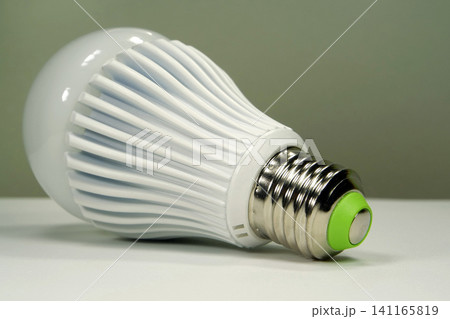 Large white LED bulb with E27 base isolated on neutral background Large white LED bulb with E27 base isolated on neutral background 141165819