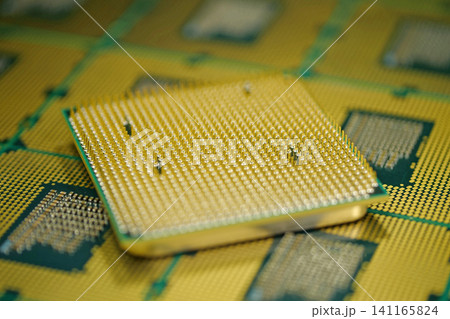 CPU with micro pins and solder pads visible for precise hardware installation CPU with micro pins and solder pads visible for precise hardware installation 141165824