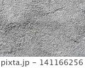 Closeup grainy gray surface texture with rough granular detail, minimal abstract background 141166256