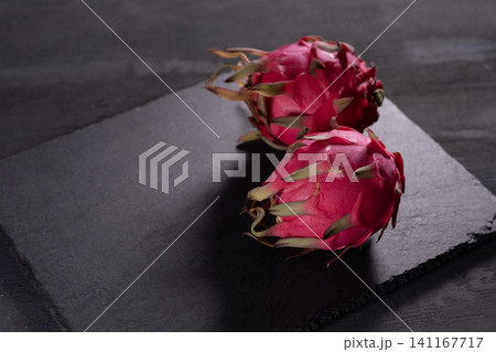 Dragon fruit on a grey granite background Dragon fruit on a grey granite background 141167717