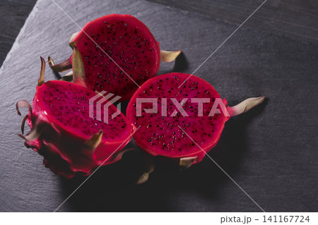 Dragon fruit on a grey granite background Dragon fruit on a grey granite background 141167724