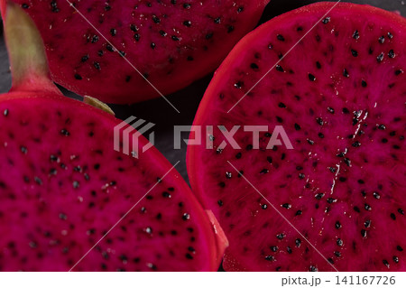 Dragon fruit on a grey granite background Dragon fruit on a grey granite background 141167726