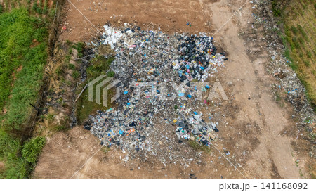 Aerial view of the garbage field in rural Thailand. It provides a specific place for the disposal of garbage. A landfill is a carefully engineered site designed for the permanent disposal of waste. Aerial view of the garbage field in rural Thailand. It provides a specific place for the disposal of garbage. A landfill is a carefully engineered site designed for the permanent disposal of waste. 141168092
