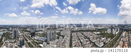 Panoramic drone bird's-eye view of District 7, Phu My Hung residential area in Ho Chi Minh City under a bright blue sky Panoramic drone bird's-eye view of District 7, Phu My Hung residential area in Ho Chi Minh City under a bright blue sky 141170118