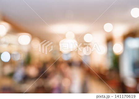 Blurred restaurant interior with warm bokeh lights for a cozy and inviting background design Blurred restaurant interior with warm bokeh lights for a cozy and inviting background design 141170619