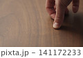 man hand check walnut wood table 141172233