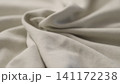 man manually check ivory color cotton fabric for clothing with hands 141172238