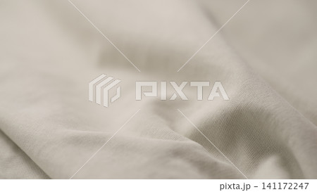 ivory color cotton fabric for clothing closeup ivory color cotton fabric for clothing closeup 141172247