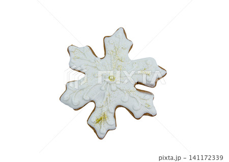 Christmas gingerbread cookie made in shape of snowflake isolated on white background Christmas gingerbread cookie made in shape of snowflake isolated on white background 141172339