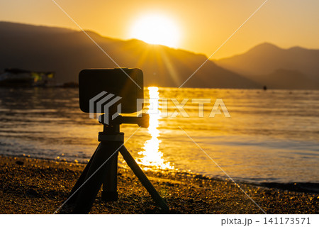 Action camera filming Marmaris Waterfront at Golden Hour with Sea Mountains and Boat 141173571