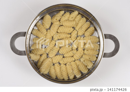 Top View of Cooked Cottage Cheese Gnocchi with Chives Top View of Cooked Cottage Cheese Gnocchi with Chives 141174426