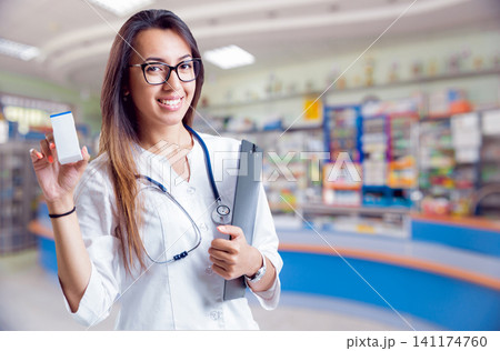Pharmacist showing medication Pharmacist showing medication 141174760