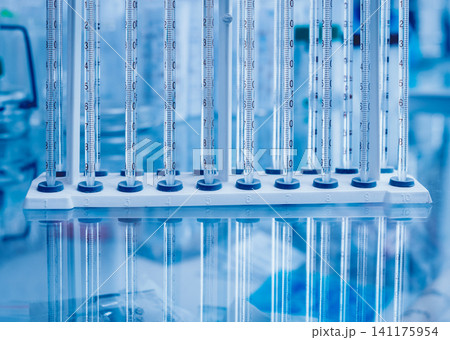 Test tube on blue background. 141175954