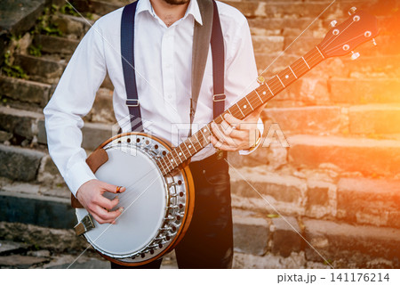 View of musician playing banjo at the street 141176214