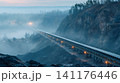 Industrial belt conveyor operating in foggy quarry 141176446