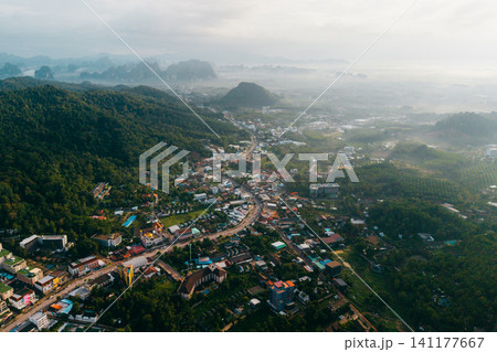 High Altitude View of Town Infrastructure and Misty Mountain Range High Altitude View of Town Infrastructure and Misty Mountain Range 141177667