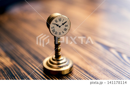 Little vintage clocks on the table. 141178114