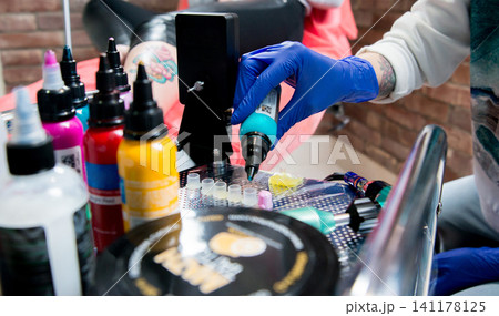 Professional tattooist 141178125