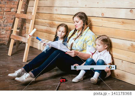Happy family in new house. Construction, repair, interior. 141178368