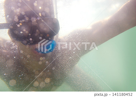 Man, snorkelling and underwater adventure for holiday vacation on tropical island for swimming, outdoor or explore. Male person, goggles and ocean travel in Florida for beach trip, journey or seaside Man, snorkelling and underwater adventure for holiday vacation on tropical island for swimming, outdoor or explore. Male person, goggles and ocean travel in Florida for beach trip, journey or seaside 141180452