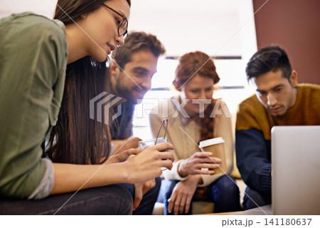 Creative team, meeting and planning with laptop at cafe for group discussion or project. Happy people, employees or young friends with technology for brainstorming or startup at coffee shop or lounge 141180637