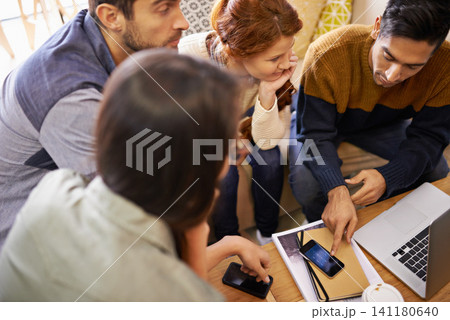 Creative people, meeting and planning with phone at cafe for team discussion or project. Group of employees or friends with technology for brainstorming or startup at coffee shop or indoor restaurant 141180640