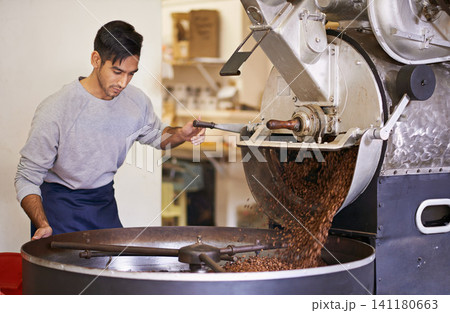 Coffee, beans and man with machine for roasting with blending, production and quality control. Entrepreneur, barista or roaster with small business at cafe, sustainable startup and espresso process 141180663