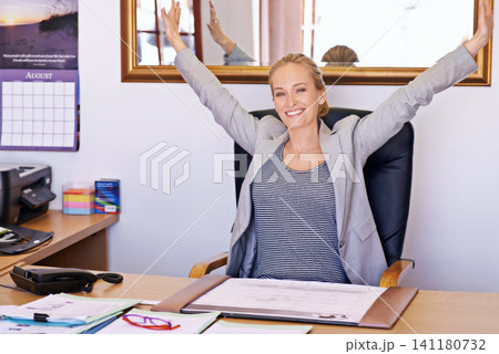 Business woman, desk and happy portrait in a office with database administrator and contract work at company. Startup, excited and smile from a professional with paperwork and arms up at job Business woman, desk and happy portrait in a office with database administrator and contract work at company. Startup, excited and smile from a professional with paperwork and arms up at job 141180732