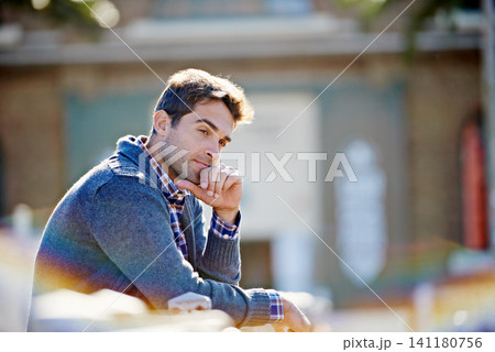 Man, think and sitting in city for idea and trip for travel or relax in urban or outdoor on blurred background. Young person and looking for view, comfort and break for wonder and pensive on mockup Man, think and sitting in city for idea and trip for travel or relax in urban or outdoor on blurred background. Young person and looking for view, comfort and break for wonder and pensive on mockup 141180756