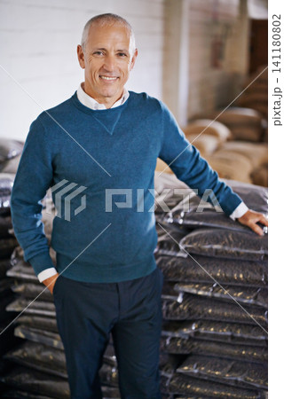 Coffee beans, storage and portrait of man with bags for distribution, quality control and confident in warehouse. Export, manufacturing and entrepreneur at factory for sustainable logistics business Coffee beans, storage and portrait of man with bags for distribution, quality control and confident in warehouse. Export, manufacturing and entrepreneur at factory for sustainable logistics business 141180802