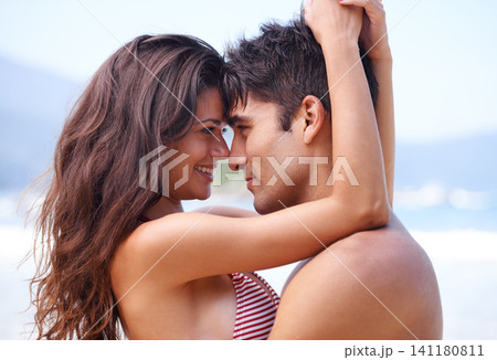 Love, romance or couple hug at a beach to relax on tropical holiday, vacation or anniversary in summer. Travel, sea or happy woman with affection, care or man in outdoor nature or ocean for wellness Love, romance or couple hug at a beach to relax on tropical holiday, vacation or anniversary in summer. Travel, sea or happy woman with affection, care or man in outdoor nature or ocean for wellness 141180811